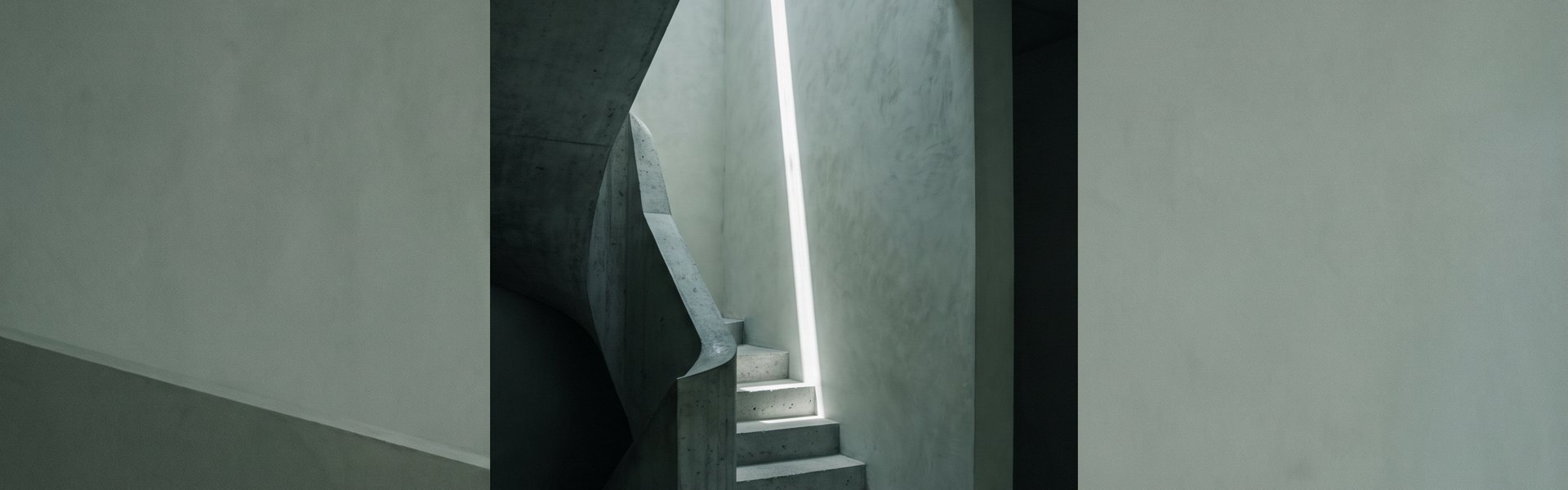 A sweeping concrete stairwell ascends, with a narrow sun blade slicing vertically down an adjacent lime plaster wall -- AI Commercial Production Stack